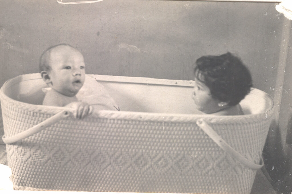 Greg and Johnny Jr in the Crib